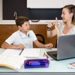 mother-helping-her-son-finish-homework_23-2148622811